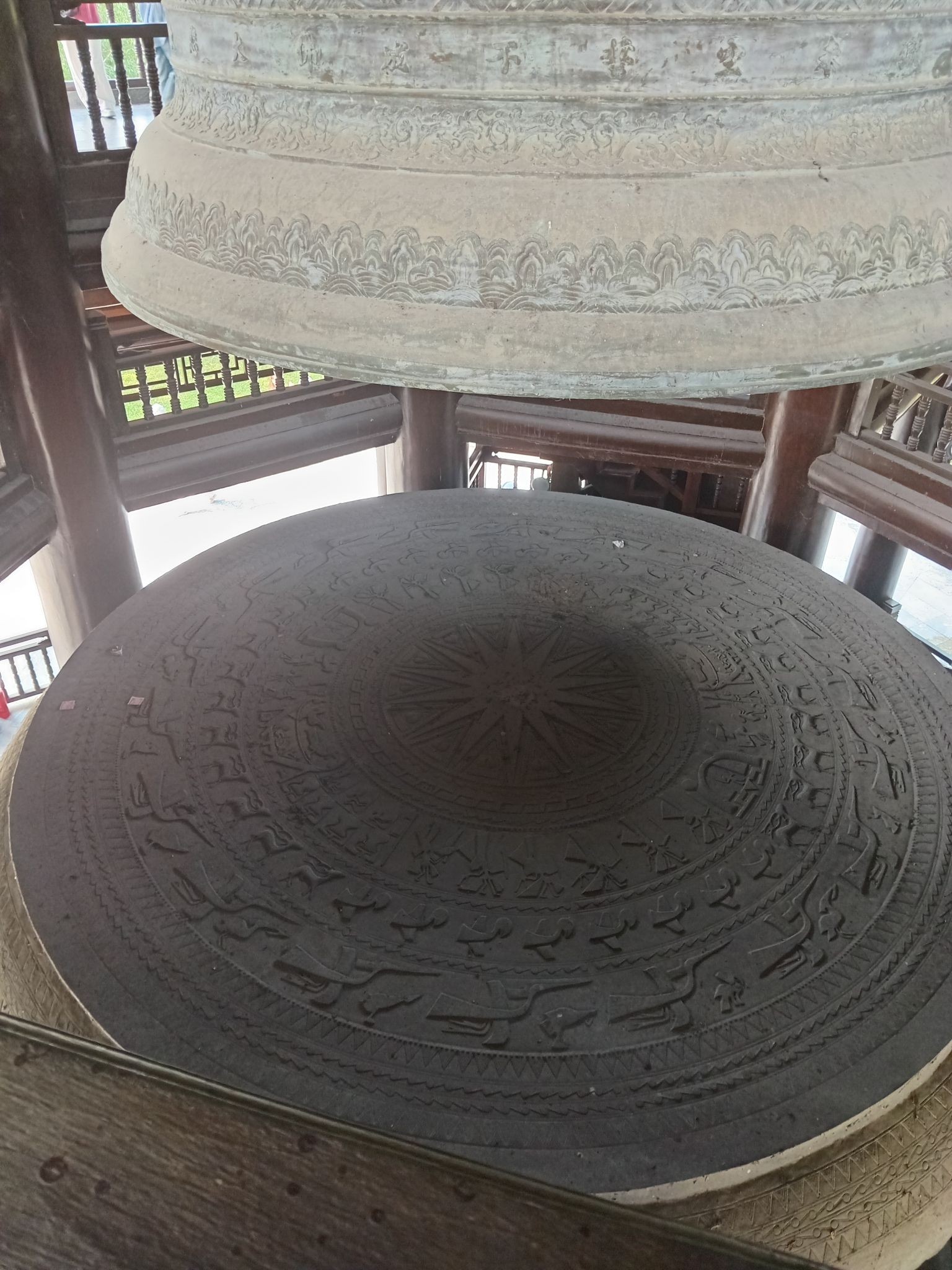 Close-up of the bronze drum replica below the bell