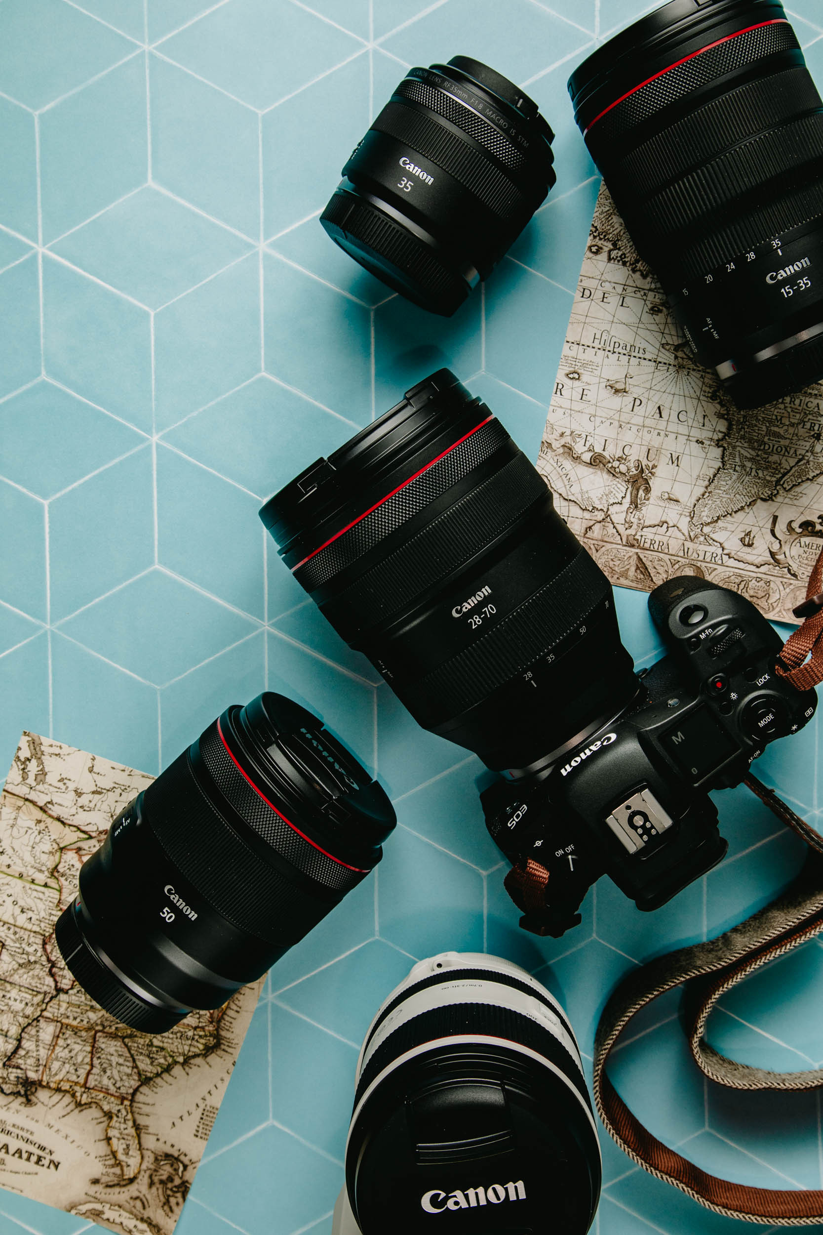 A lone traveler with a Canon RF lens attached to their camera, capturing the grandeur of Ha Long Bay, Vietnam, showcasing the lens's capability in landscape photography.
