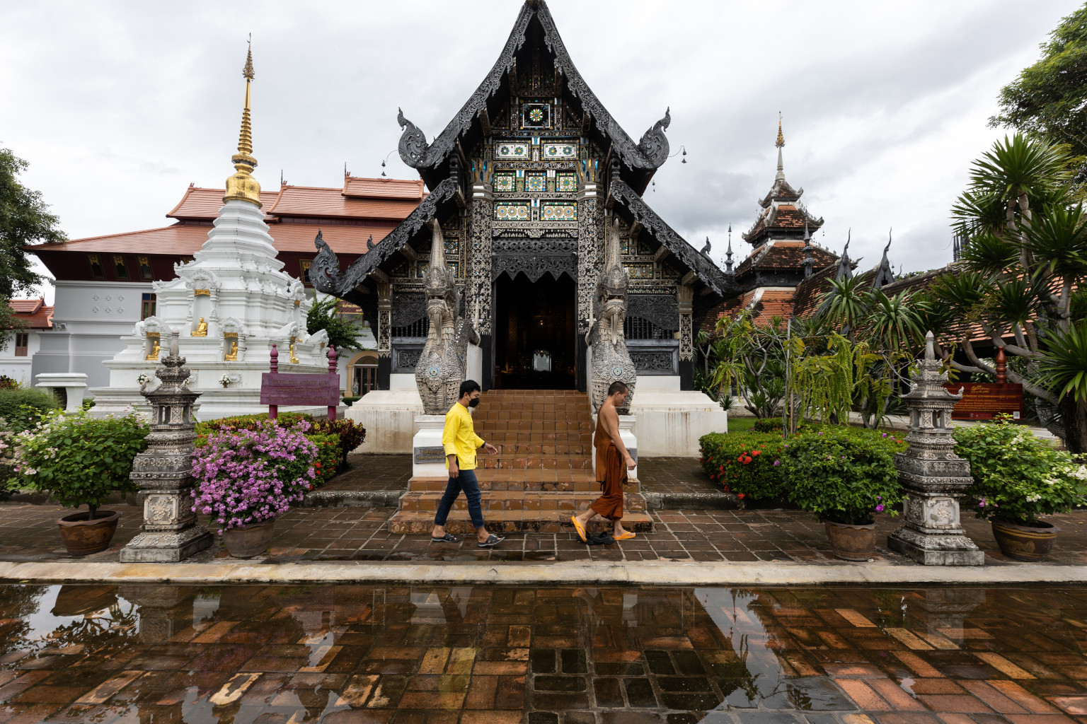 A monk walks through a near empty Wat Chedi Luang in Chiang Mai, Thailand, on Thursday, Sept. 9, 2021.