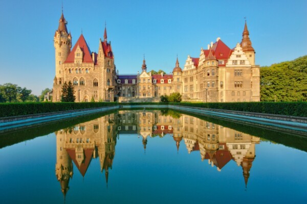 Moszna Castle in Opolskie Voivodeship, a unique fairytale castle with beautiful architecture and stunning gardens.